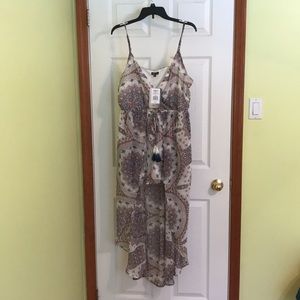 Juniors romper with long cover. Never worn
